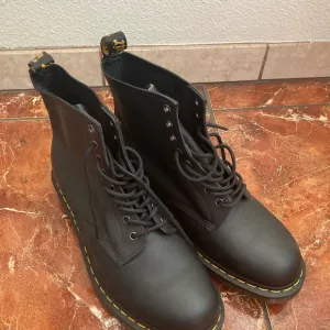 Dr. Martens Black Combat Boots with Durable Sole