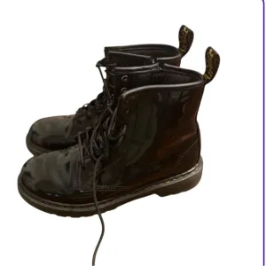 Dr. Martens Black Combat Boots with Lace-Up Design
