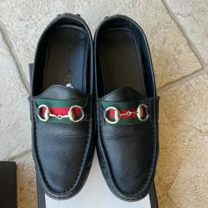 GUCCI black leather loafers.