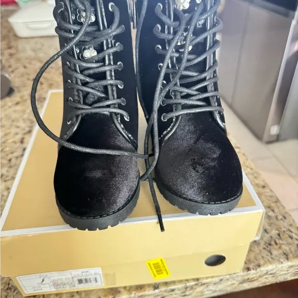 Michael Kors Black Boots with Lace-Up Design and Chunky Soles