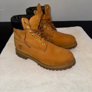 Timberland Tan and Black Boots High-Top Durable Design