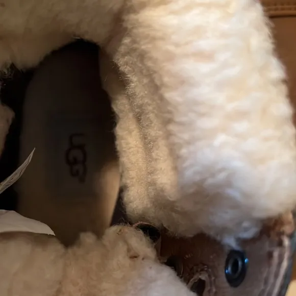 UGG children boots - size 2. Lace up color tan.